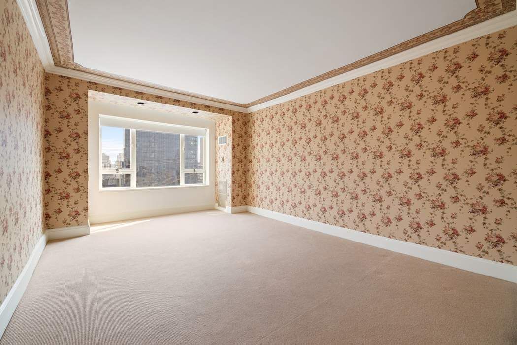 425 East 58th Street, Unit 20E Manhattan, NY 10022 - Photo 17 of 19 a view of empty room with a window