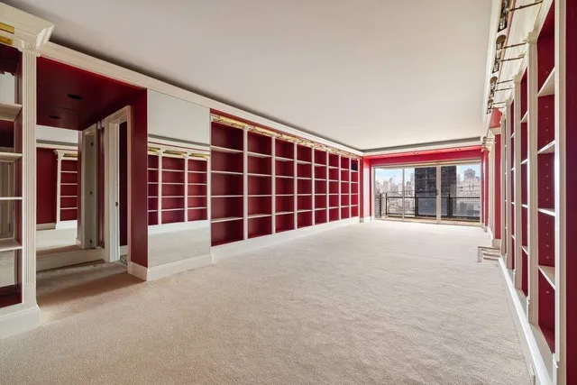 a view of empty room with windows