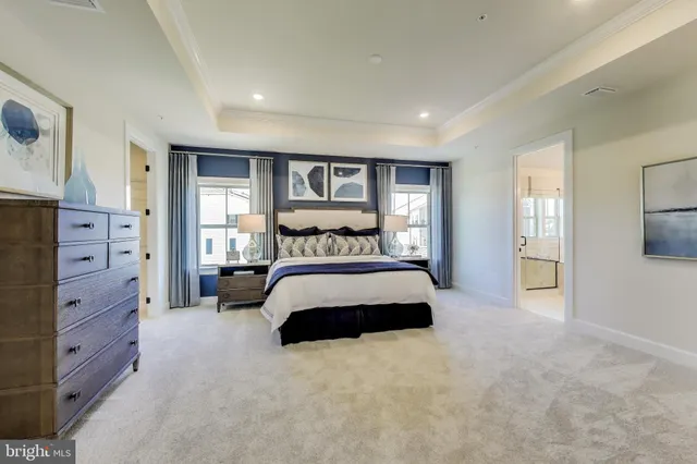 a bedroom with a large bed and a tv