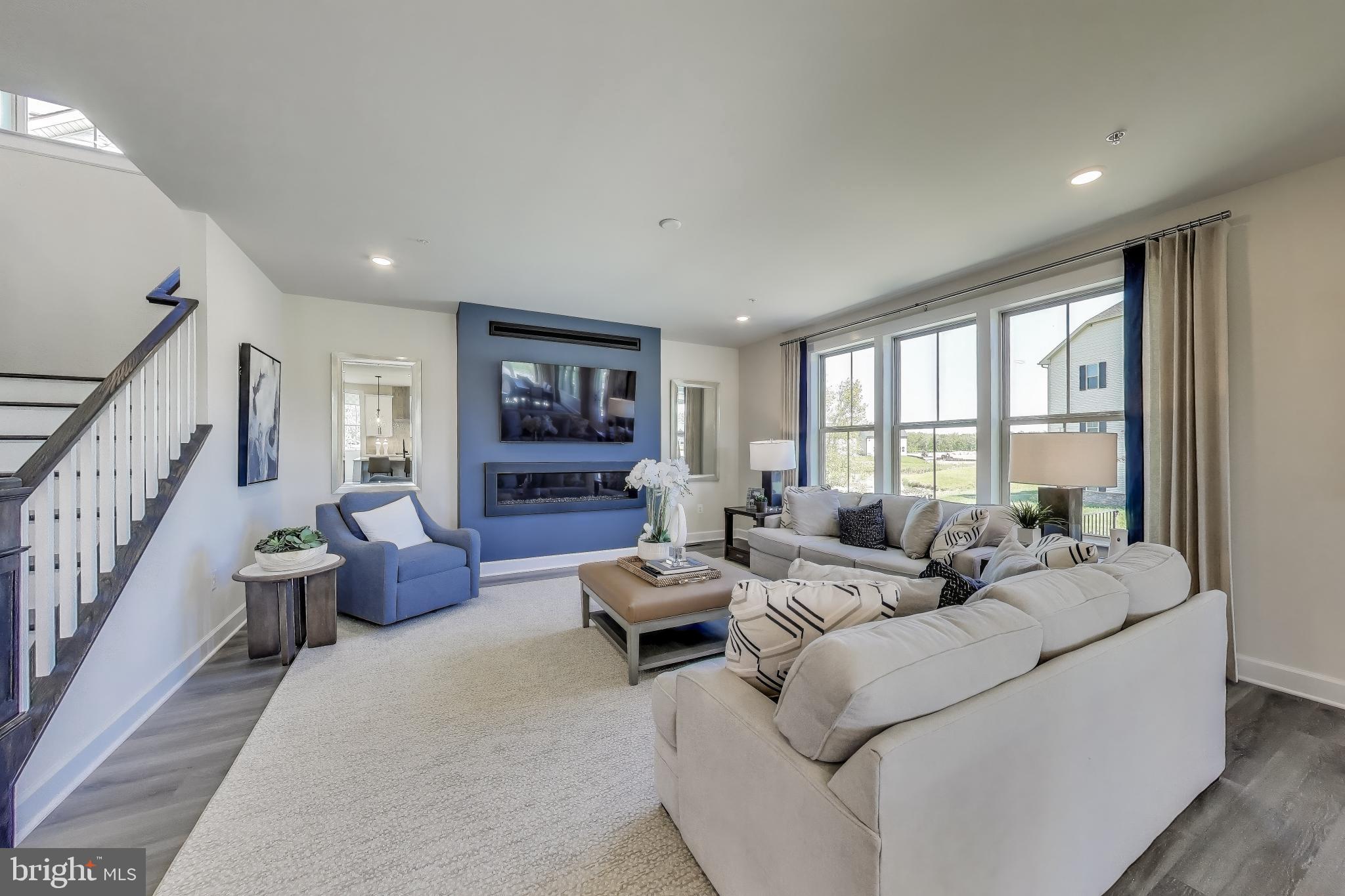 1303 Clubhouse Boulevard Laurel, MD 20708 - Photo 7 of 18 a living room with furniture or couch and a large window