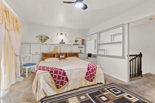 a bed room with a bed and a window