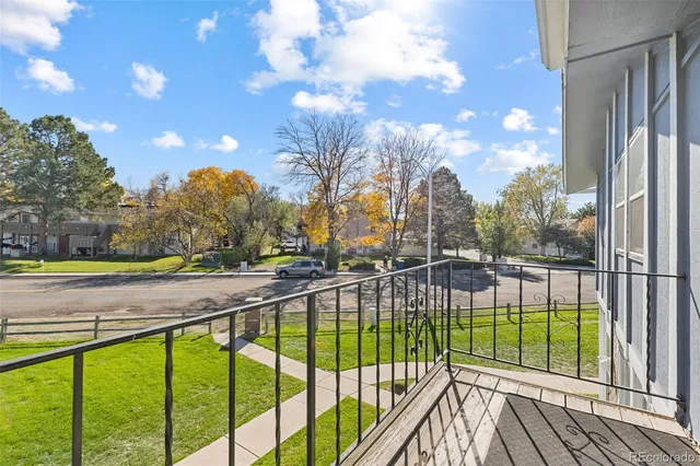 a view of swimming pool from a balcony