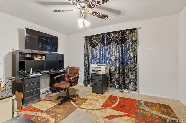 a view of a workspace with furniture