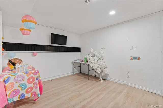 a room with toys and wooden floor