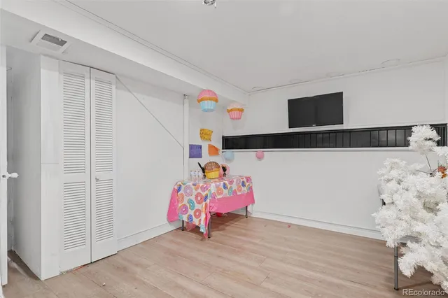 a view of play room with wooden floor