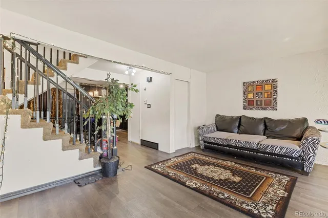 a living room with furniture and a rug