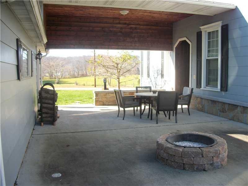 137 Long Street Rices Landing, PA 15357 - Photo 2 of 23 Patio/Deck. LARGE COVERED PATIO WITH FIRE PIT