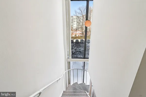 a view of a hallway with windows