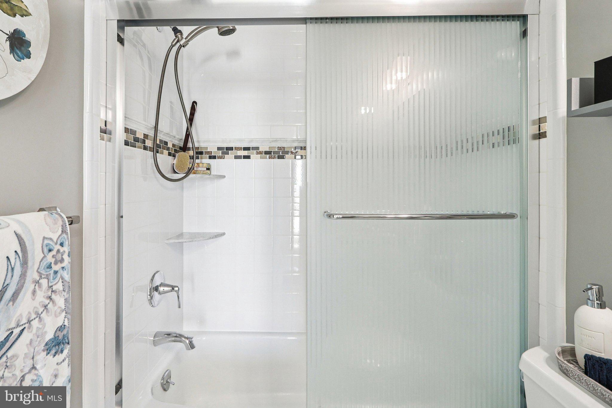 9900 Georgia Avenue, Unit 27217 Silver Spring, MD 20902 - Photo 27 of 50 a bathroom with a shower