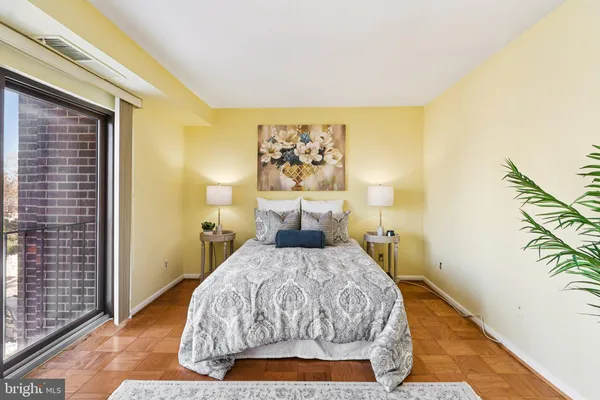 a view of a door and wooden floor in a room