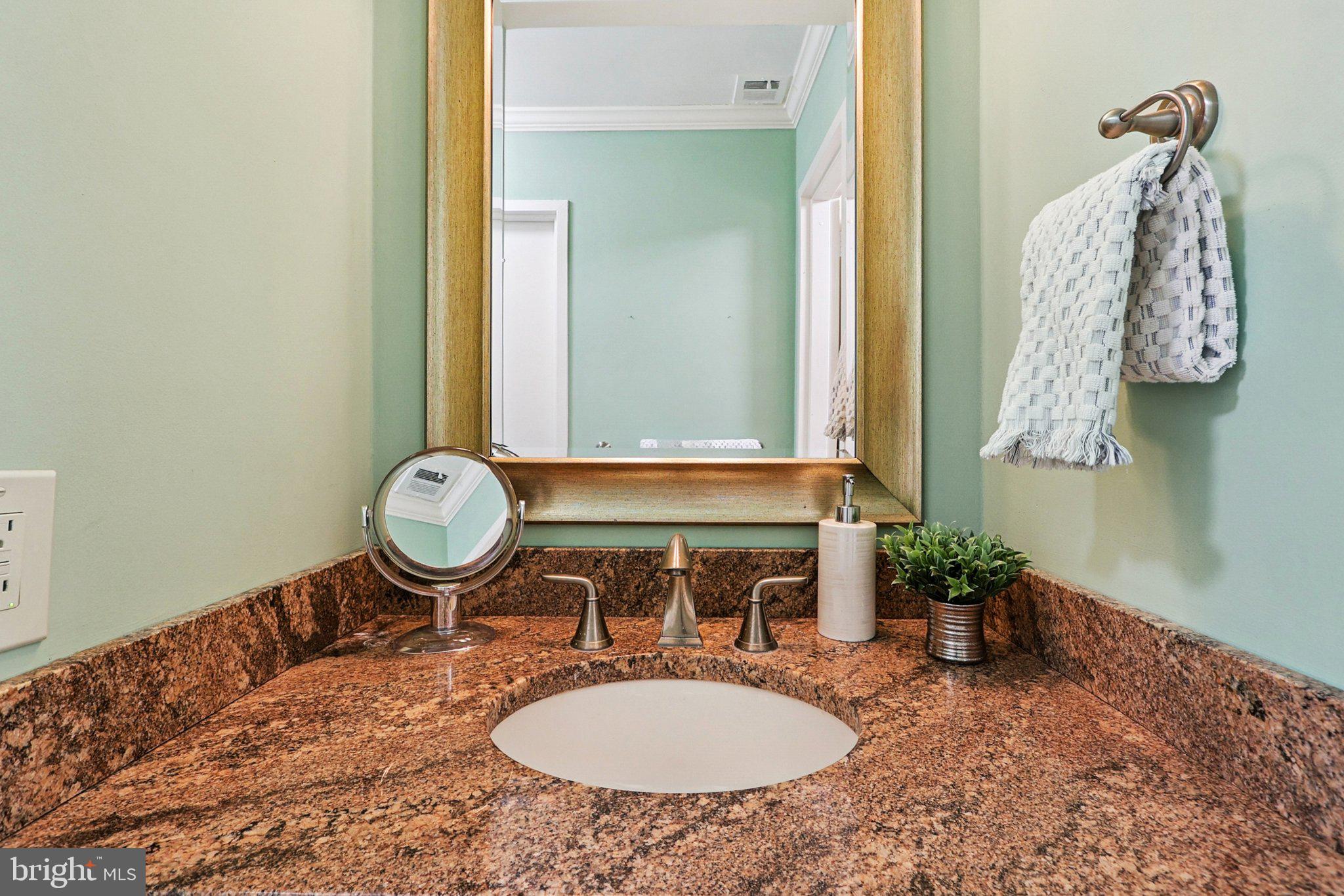 9900 Georgia Avenue, Unit 27217 Silver Spring, MD 20902 - Photo 39 of 50 a bathroom with a sink and a mirror
