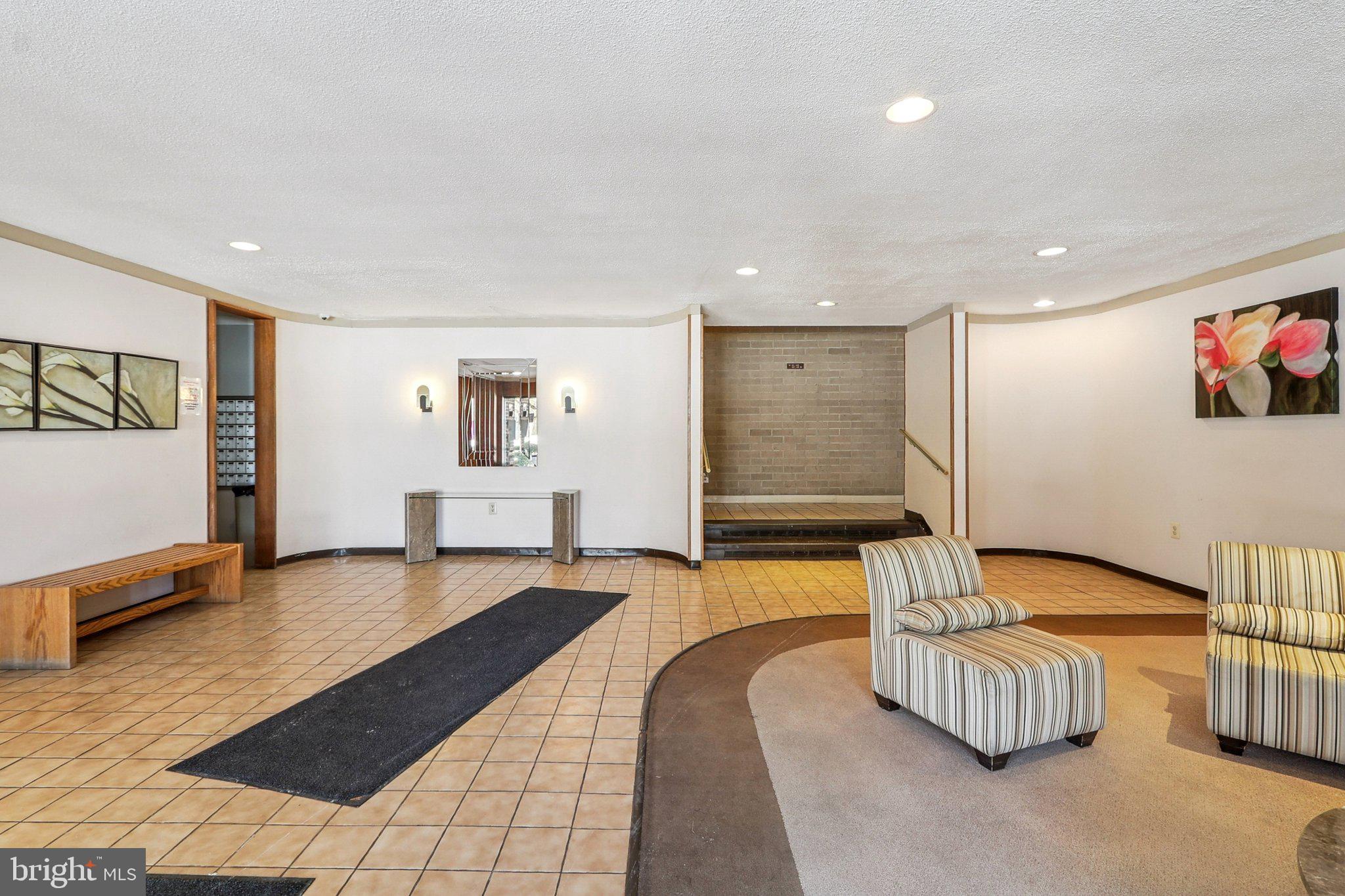 9900 Georgia Avenue, Unit 27217 Silver Spring, MD 20902 - Photo 46 of 50 a living room with furniture and a couch