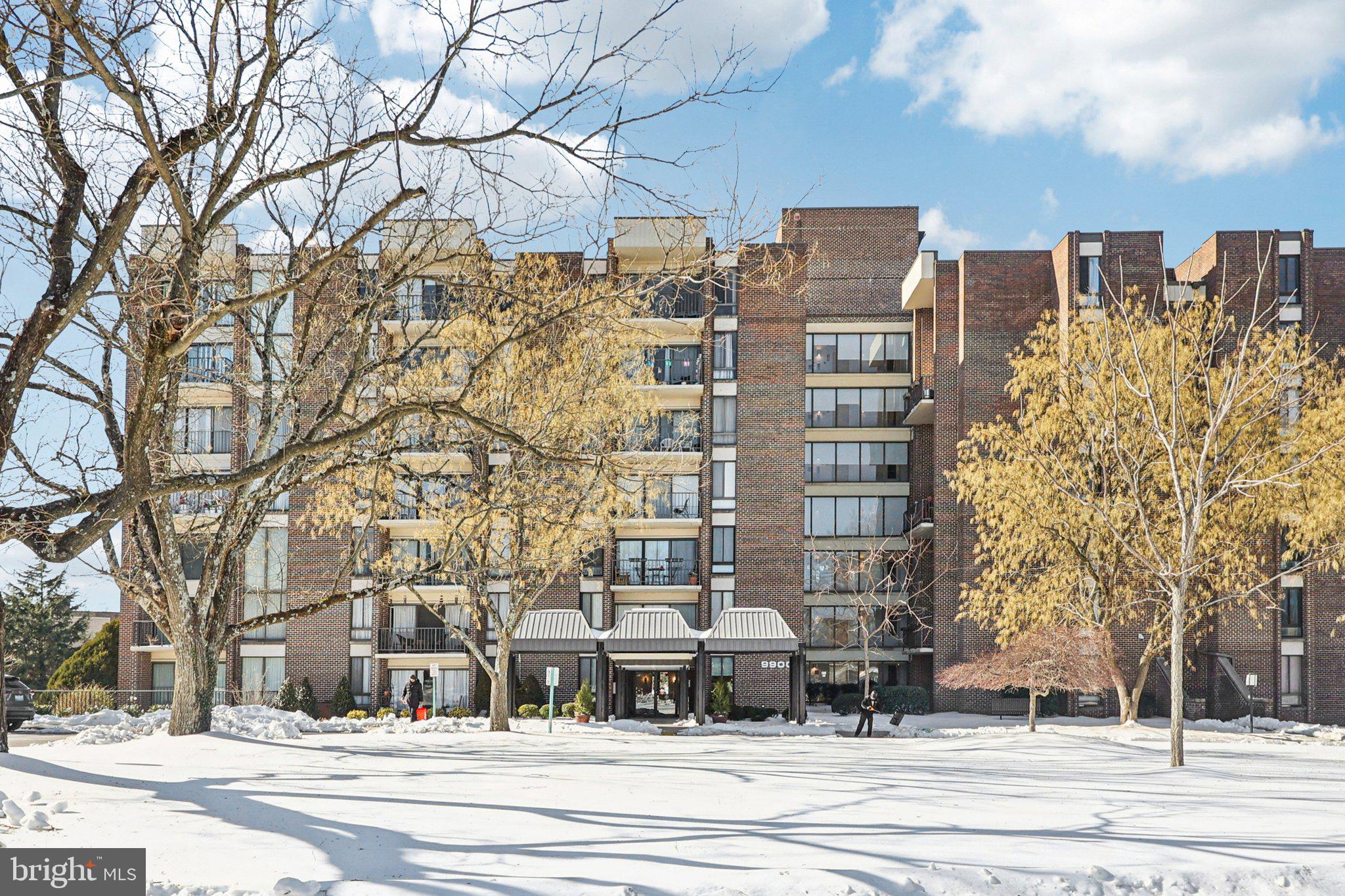 9900 Georgia Avenue, Unit 27217 Silver Spring, MD 20902 - Photo 47 of 50 front view of a building and trees