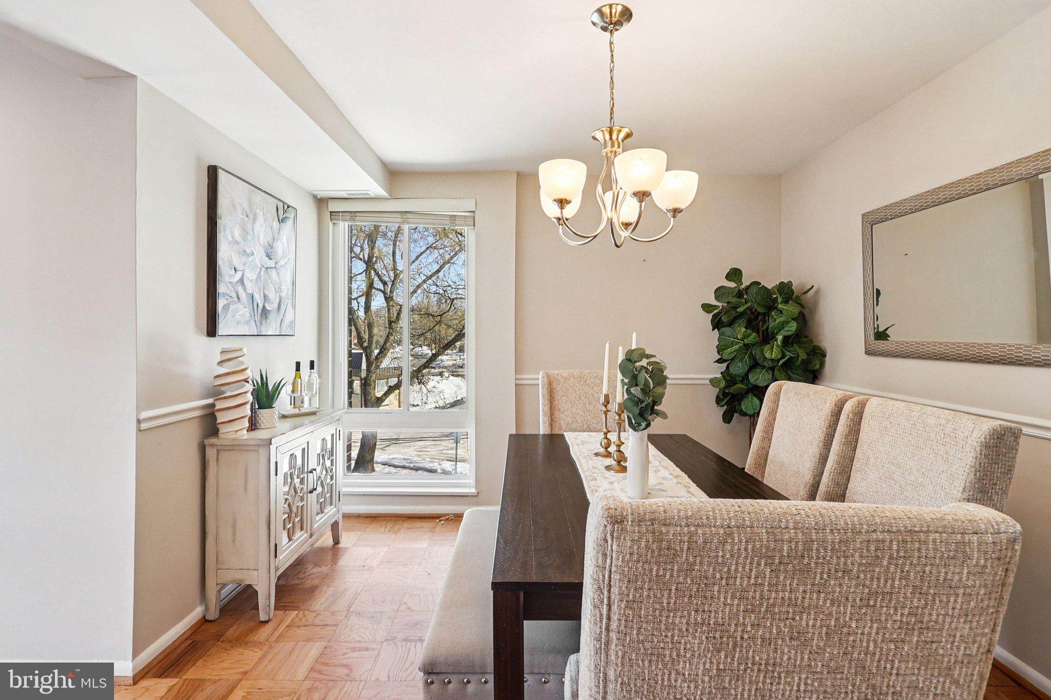 9900 Georgia Avenue, Unit 27217 Silver Spring, MD 20902 - Photo 10 of 50 a living room with furniture chandelier and a fireplace