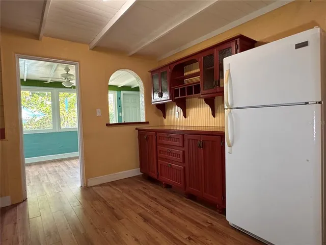 a view of a livingroom with furniture window and wooden floor