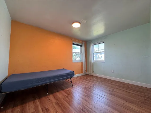 a kitchen with cabinets and a wooden floors