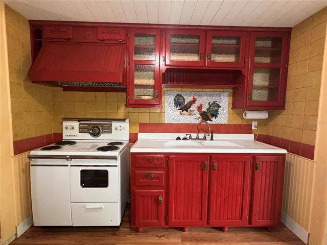 a kitchen with a stove and a microwave