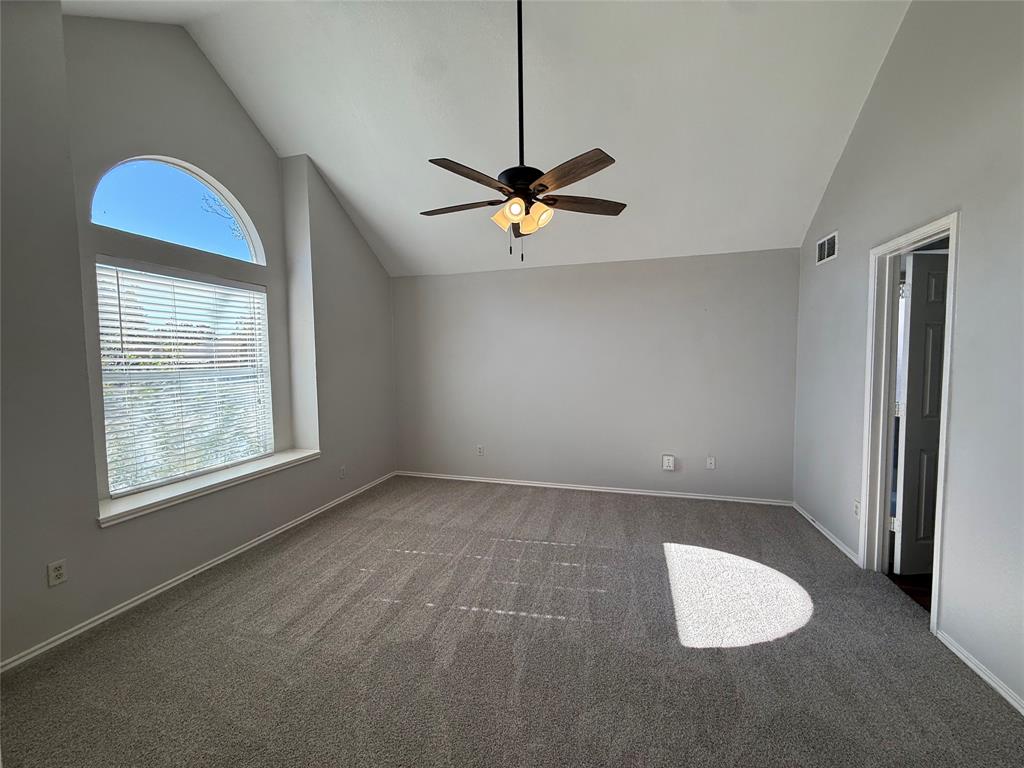 7913 Rice Drive Rowlett, TX 75088 - Photo 11 of 20 an empty room with windows and fan