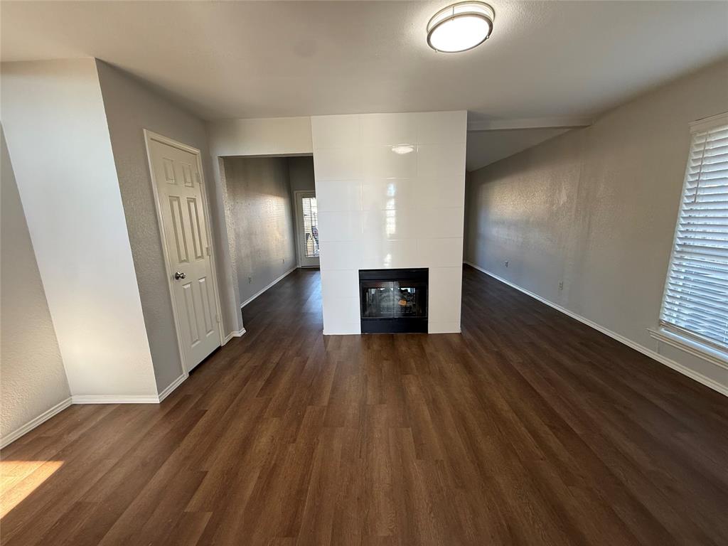 7913 Rice Drive Rowlett, TX 75088 - Photo 3 of 20 a view of a hallway with wooden floor