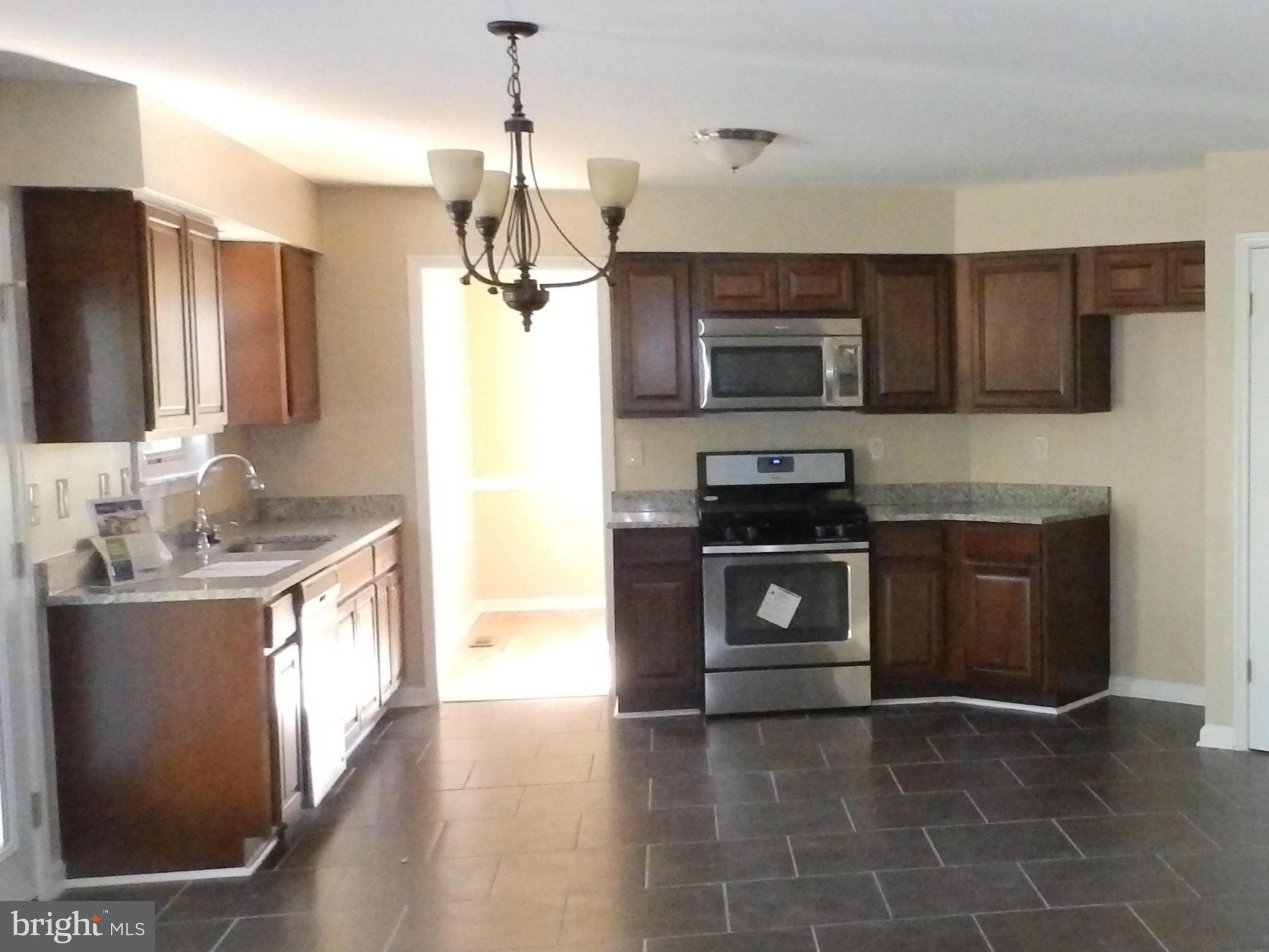 1780 Bennett Road Sykesville, MD 21784 - Photo 8 of 27 Kitchen with granite, new cabs, SS & ceramic floor