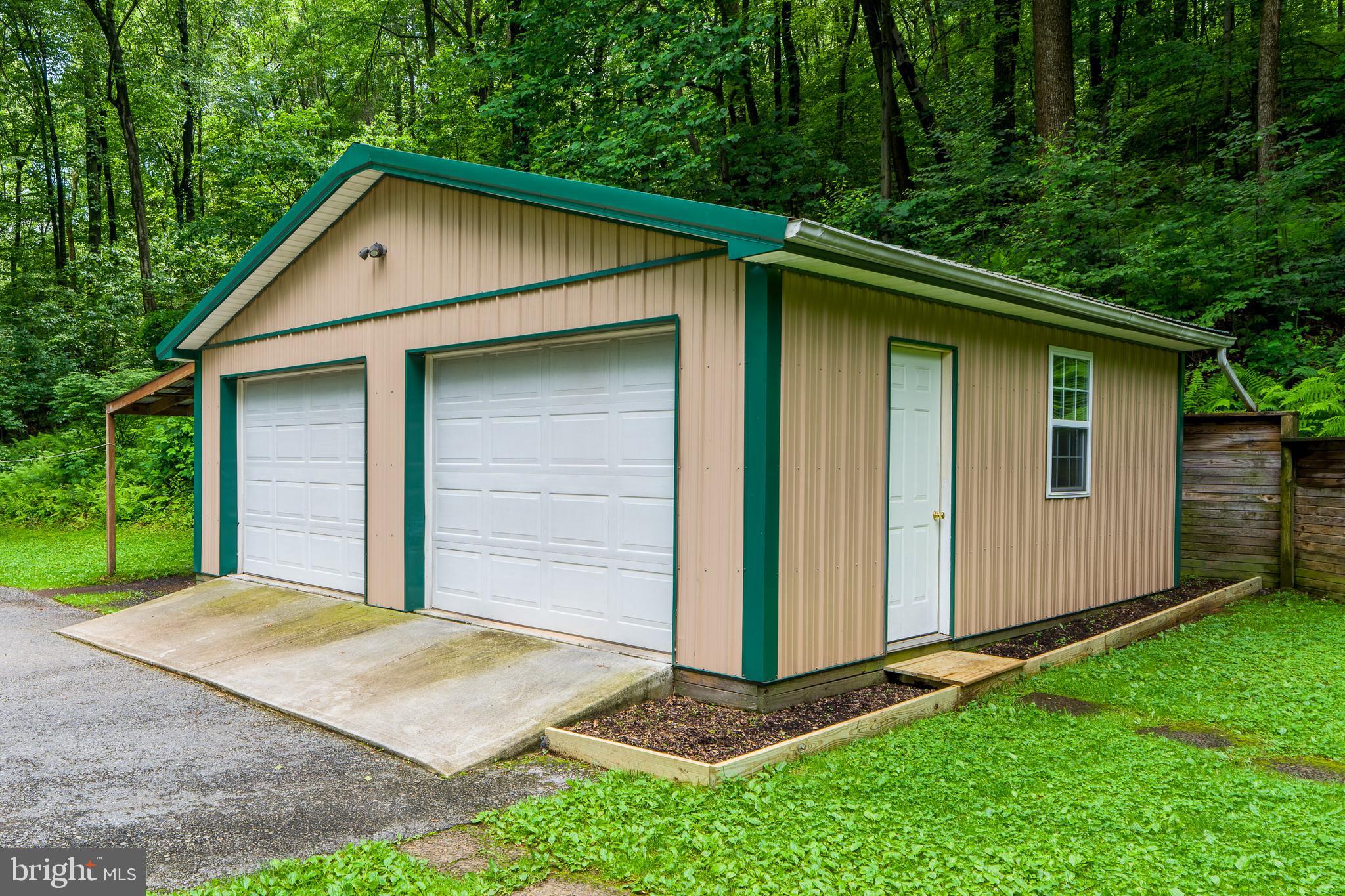 135 Fraelich Road Denver, PA 17517 - Photo 11 of 53 a front view of a house with a yard