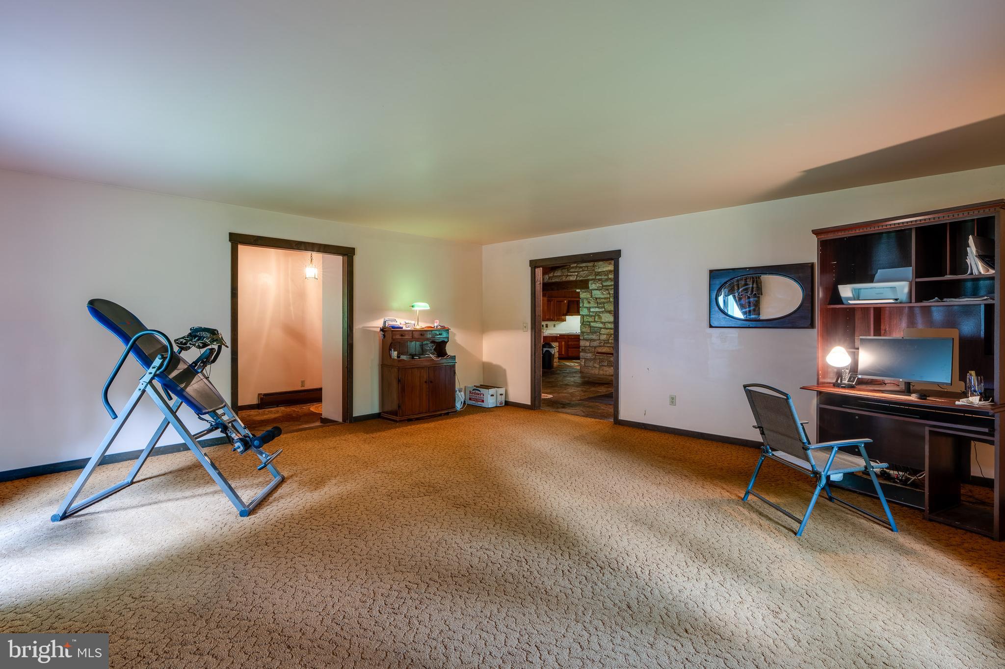 135 Fraelich Road Denver, PA 17517 - Photo 17 of 53 a view of a workspace with furniture and a window
