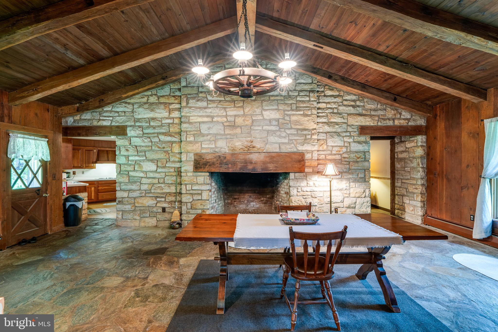 135 Fraelich Road Denver, PA 17517 - Photo 21 of 53 a dining room with a wooden table and chairs