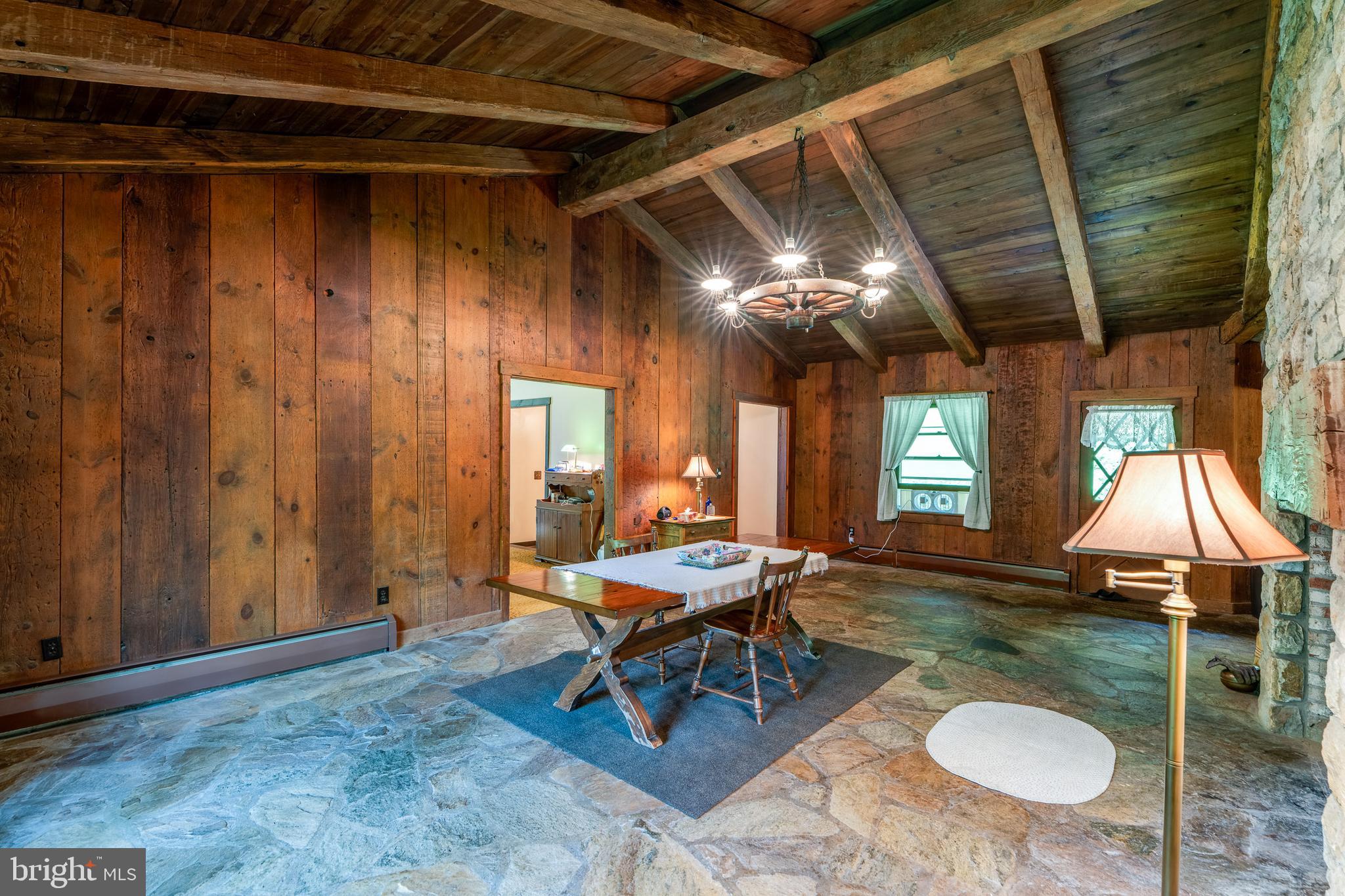 135 Fraelich Road Denver, PA 17517 - Photo 23 of 53 a living room with furniture and a chandelier