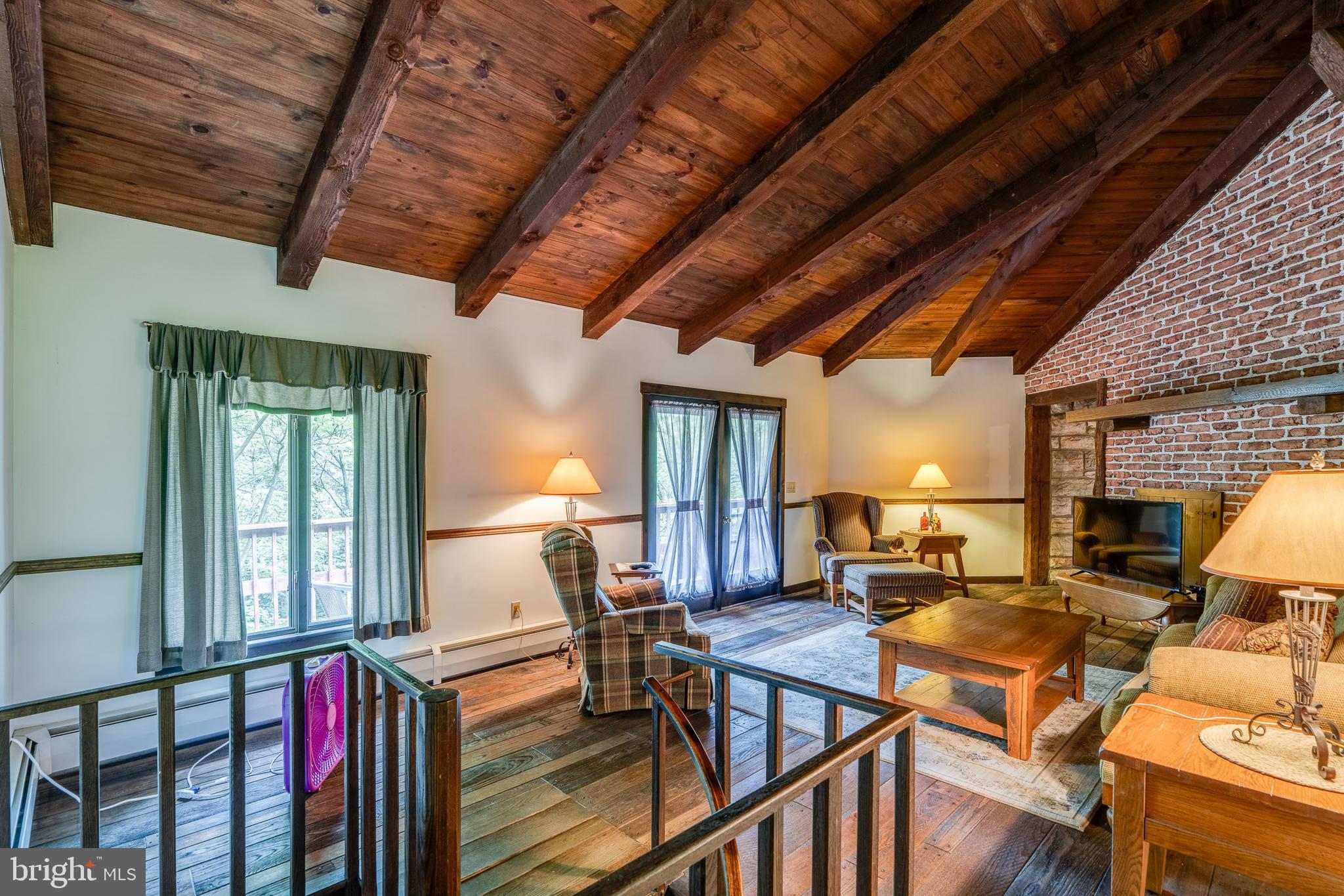 135 Fraelich Road Denver, PA 17517 - Photo 29 of 53 a living room with lots of furniture wooden floor and next to a window