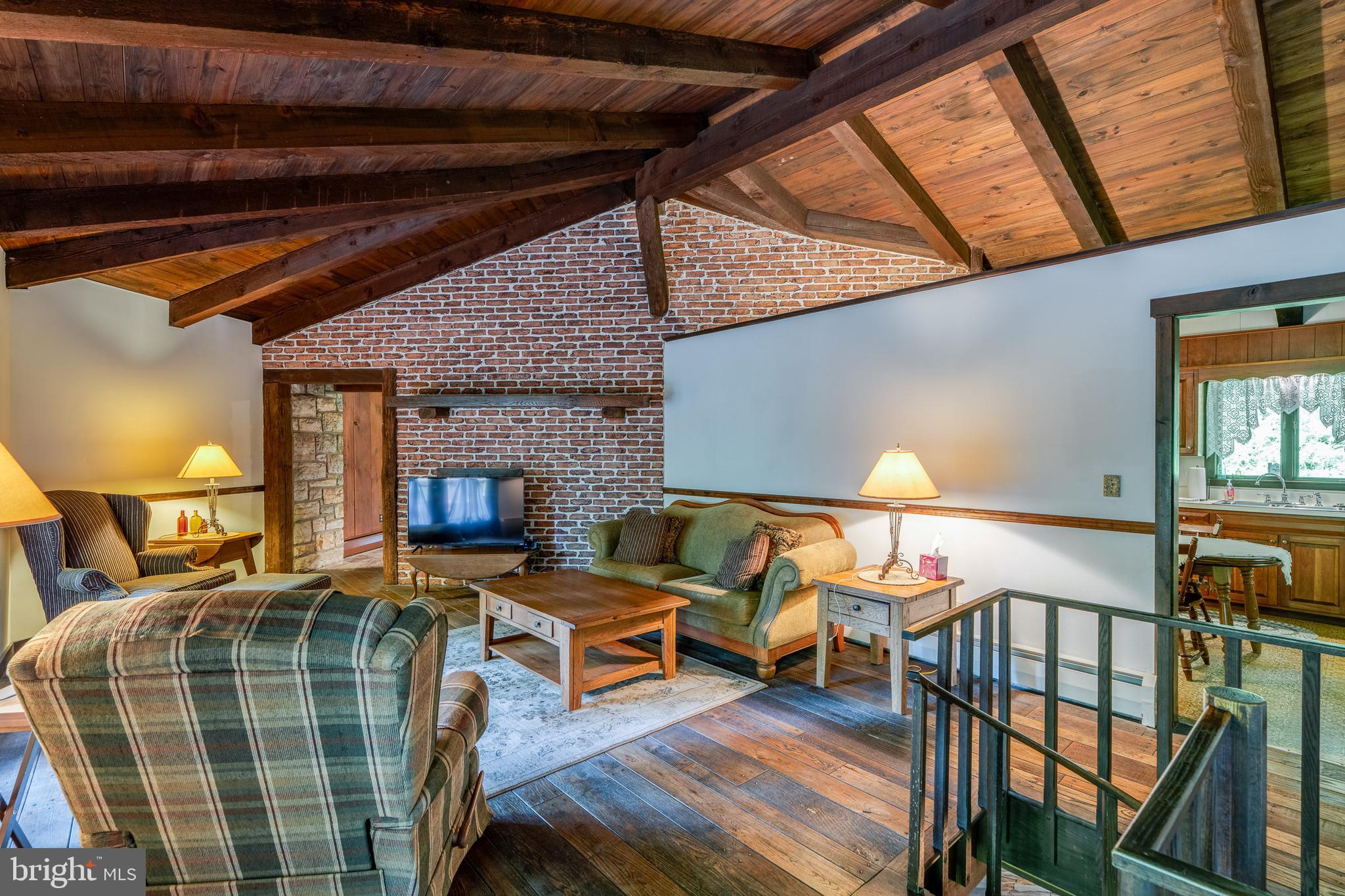 135 Fraelich Road Denver, PA 17517 - Photo 30 of 53 a living room with furniture a rug and a window