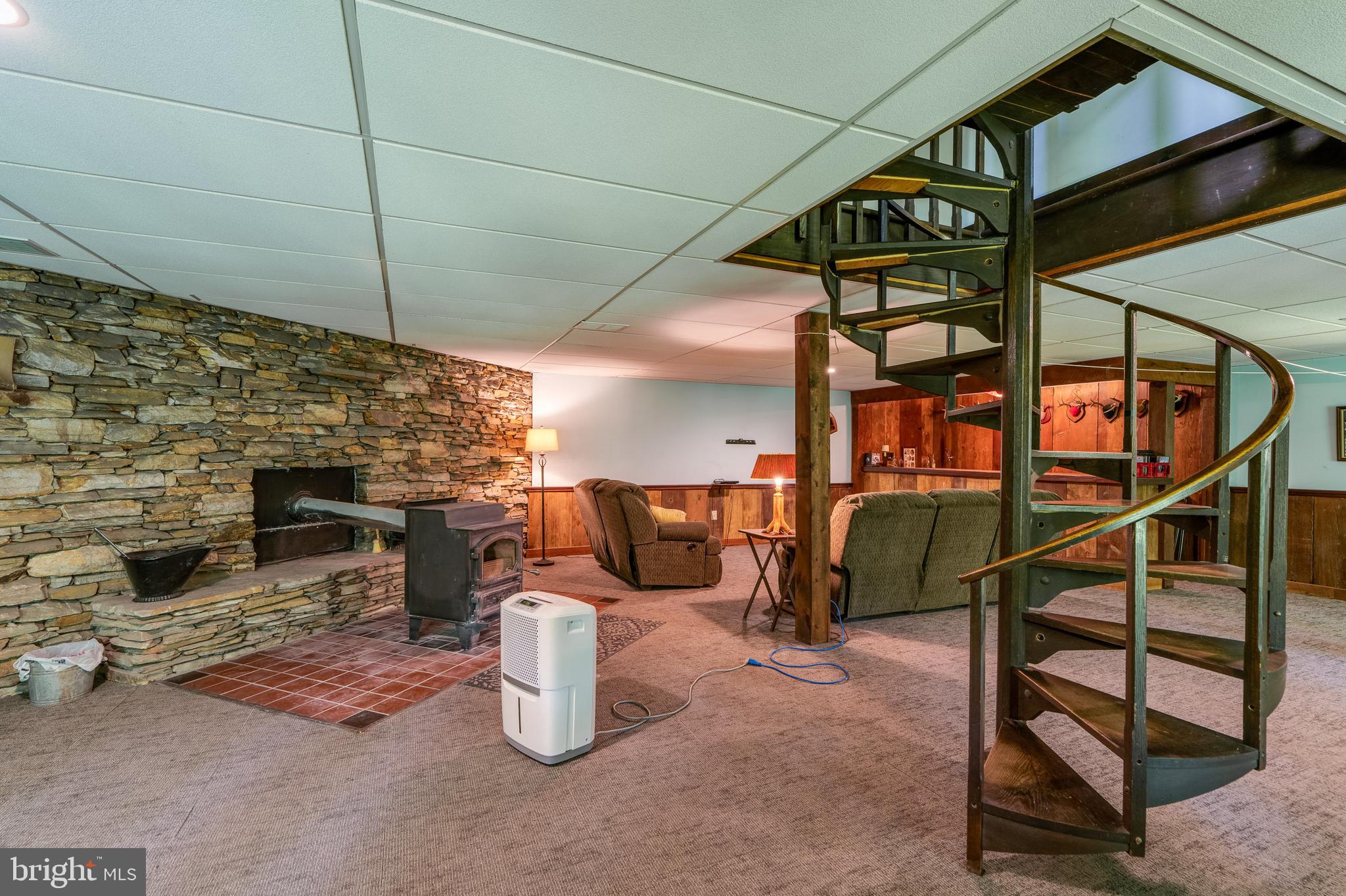 135 Fraelich Road Denver, PA 17517 - Photo 42 of 53 a room with wooden floor and furniture