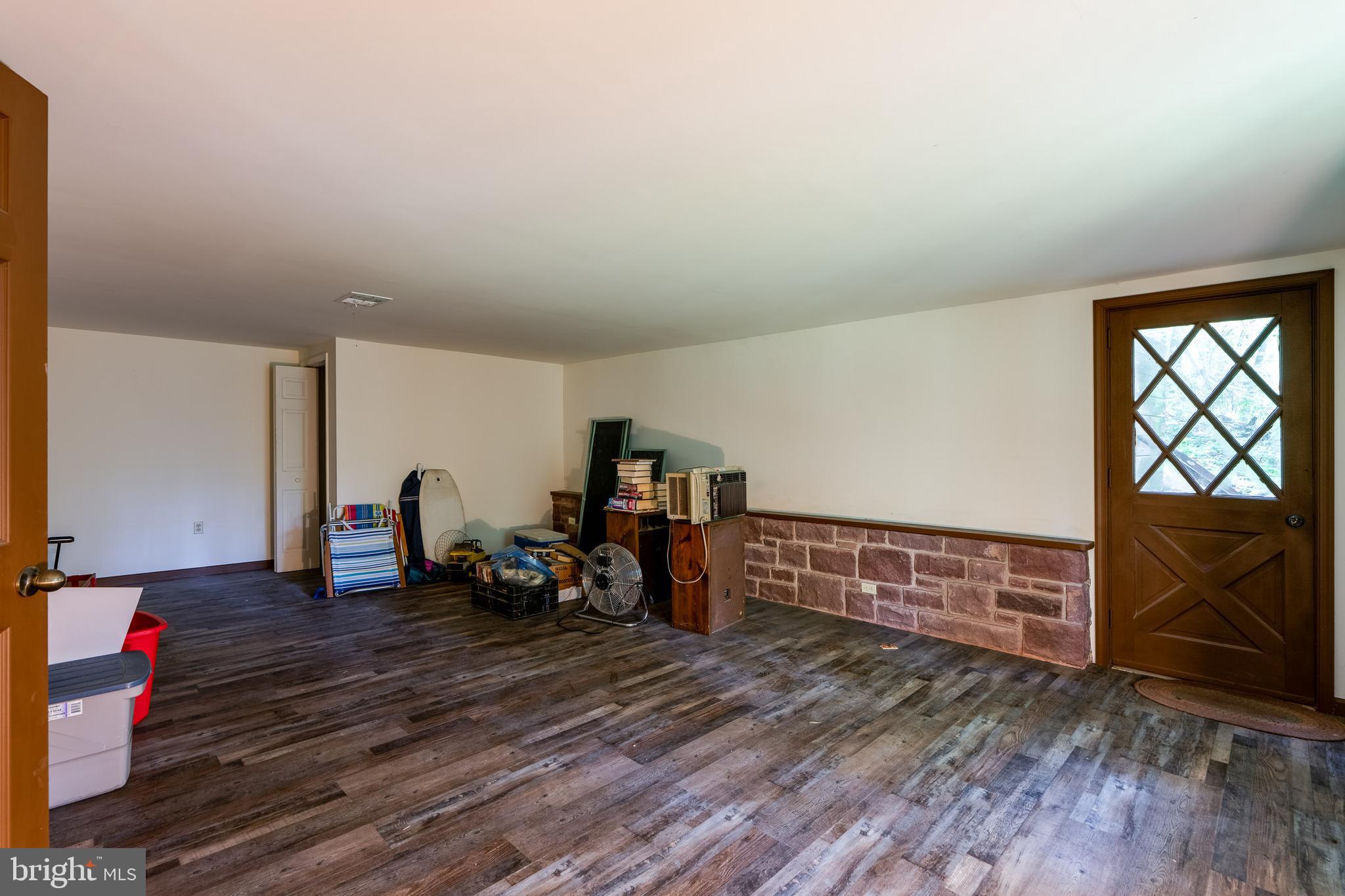 135 Fraelich Road Denver, PA 17517 - Photo 48 of 53 a view of a room with wooden floor and furniture