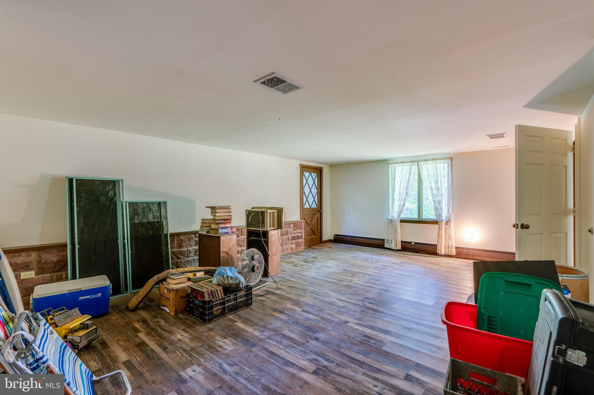 135 Fraelich Road Denver, PA 17517 - Photo 49 of 53 a bed room with a bed and a chair