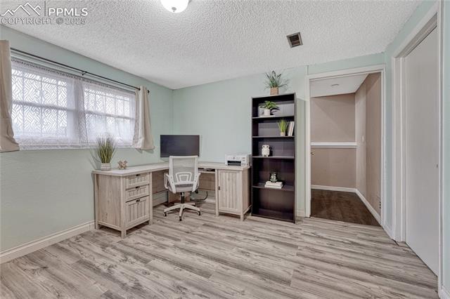 7108 Chippewa Road Colorado Springs, CO 80915 - Photo 20 of 40 Lower level rec room is spacious and offers room for an office