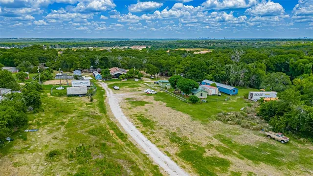 an aerial view of residential house with outdoor space and outdoor