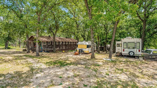 a house with trees in the background