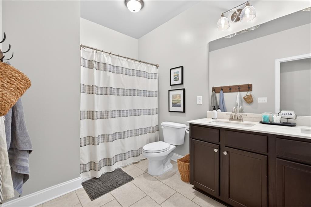 163 Hewett Road Pendergrass, GA 30567 - Photo 37 of 82 a bathroom with a sink toilet and shower