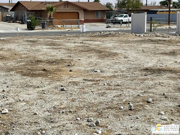 a view of a backyard of the house