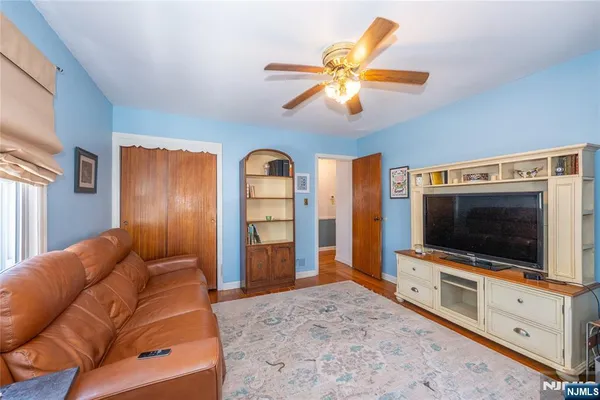 a bedroom with bed and a window