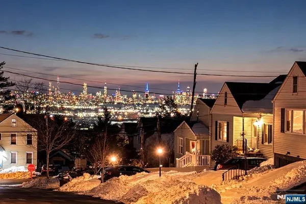 a living room with furniture and a piano