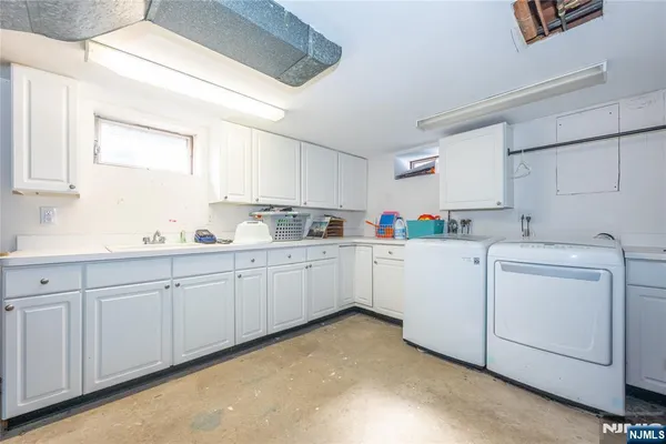 a utility room with cabinets