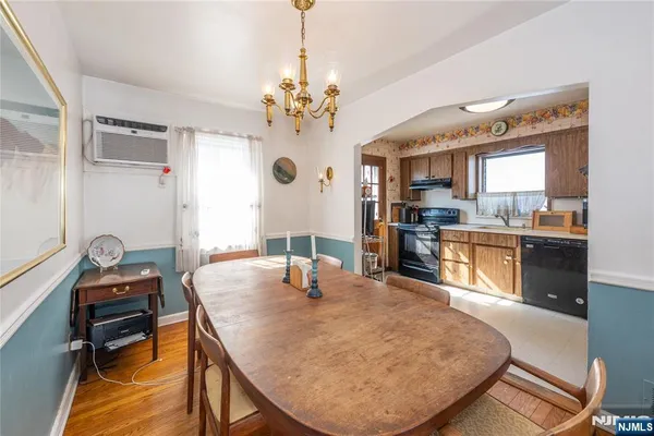 a kitchen with kitchen island a stove a sink and a microwave