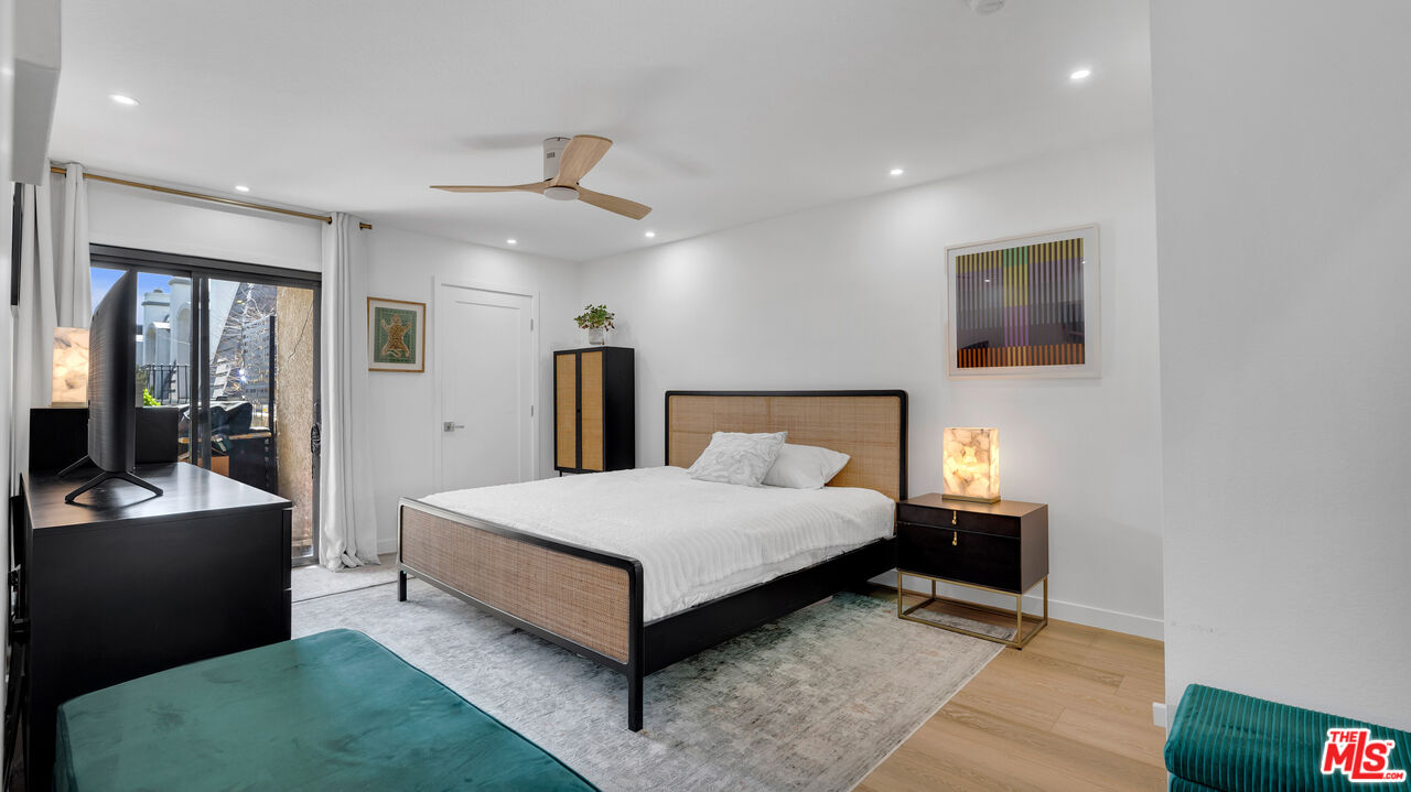 8601 Falmouth Avenue, Unit 224 Playa del Rey, CA 90293 - Photo 13 of 41 a spacious bedroom with a bed and a mirror