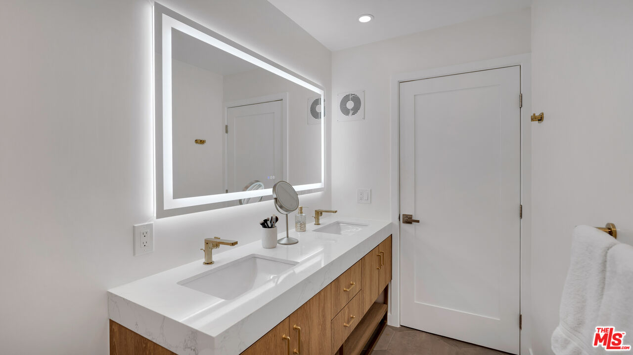 8601 Falmouth Avenue, Unit 224 Playa del Rey, CA 90293 - Photo 16 of 41 a bathroom with a sink and a mirror