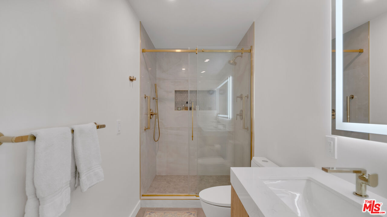 8601 Falmouth Avenue, Unit 224 Playa del Rey, CA 90293 - Photo 17 of 41 a bathroom with a bathtub shower sink vanity and toilet