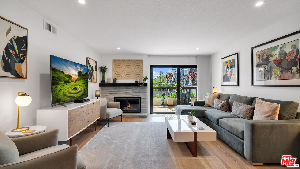 8601 Falmouth Avenue, Unit 224 Playa del Rey, CA 90293 - Photo 2 of 41 a living room with furniture and a flat screen tv