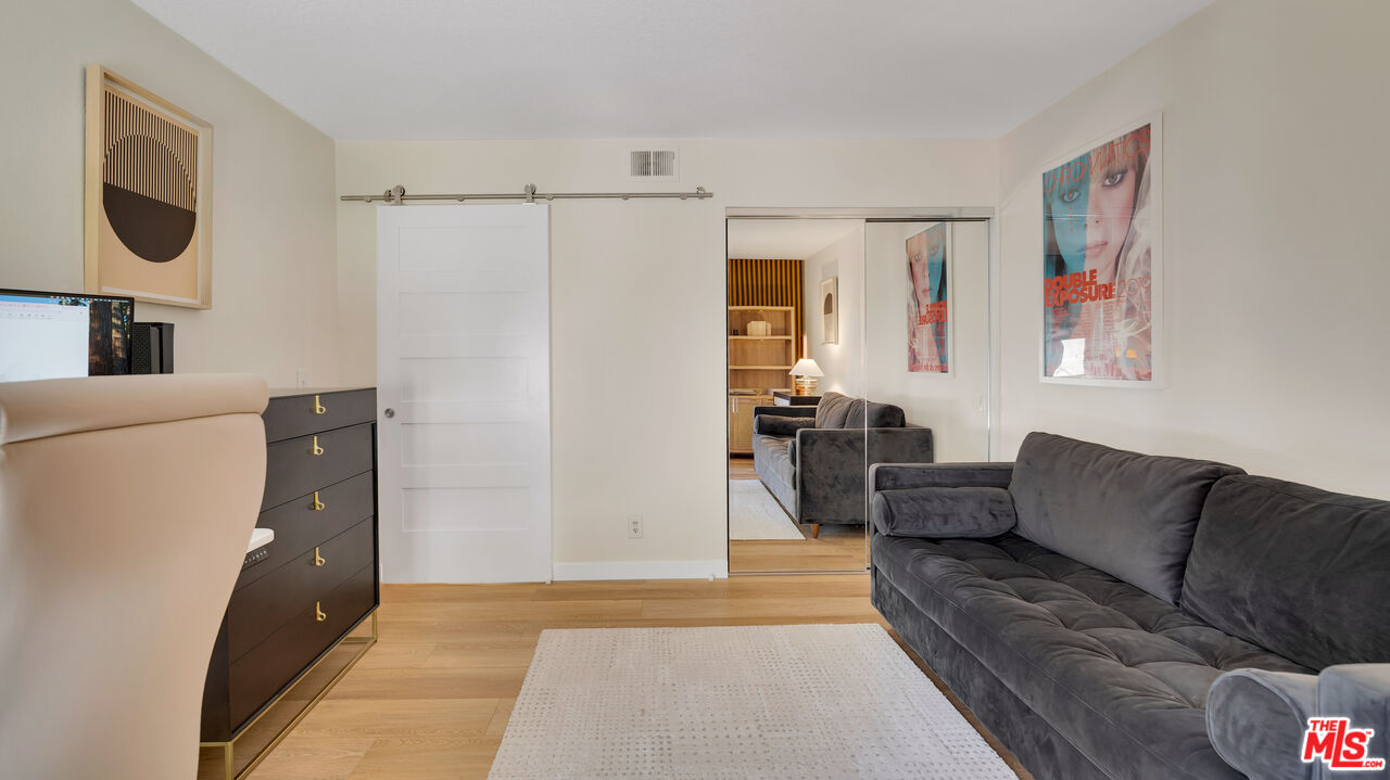 8601 Falmouth Avenue, Unit 224 Playa del Rey, CA 90293 - Photo 21 of 41 a living room with furniture and a rug