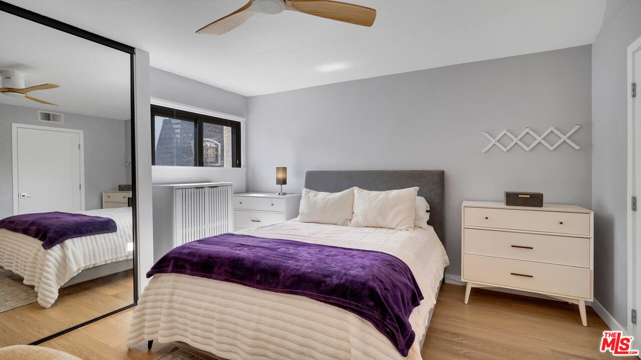 8601 Falmouth Avenue, Unit 224 Playa del Rey, CA 90293 - Photo 23 of 41 a bedroom with a bed and a couch
