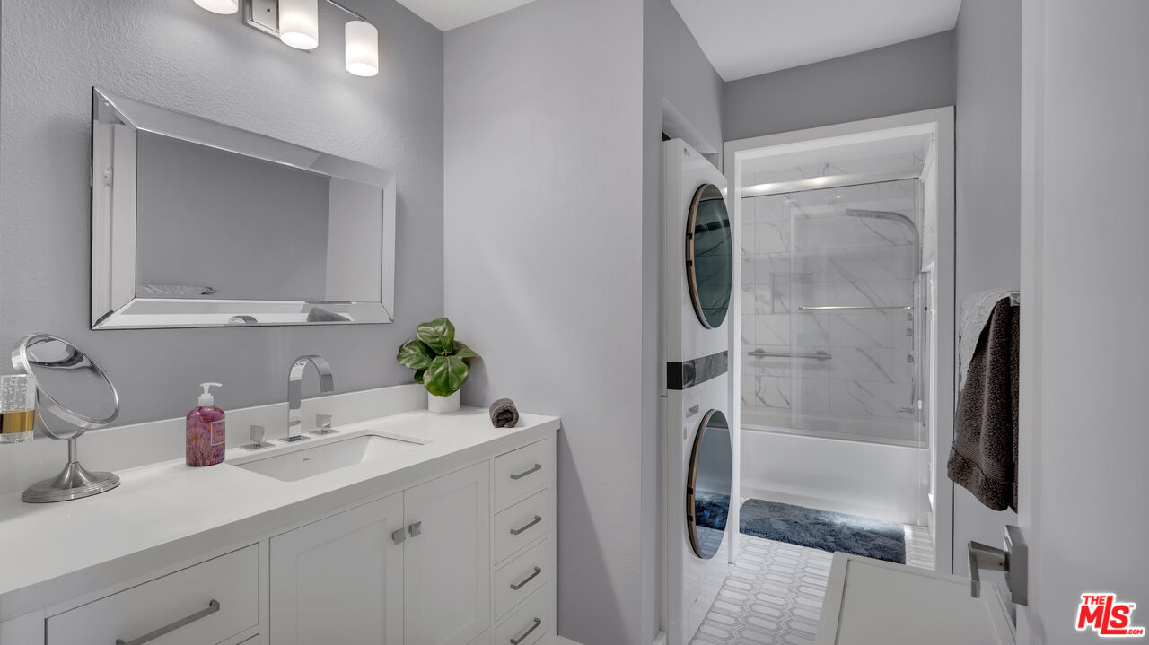 8601 Falmouth Avenue, Unit 224 Playa del Rey, CA 90293 - Photo 24 of 41 a bathroom with a sink vanity and mirror