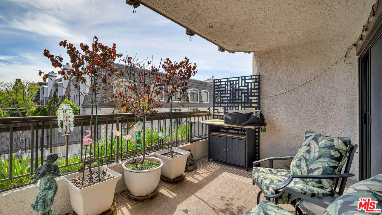 8601 Falmouth Avenue, Unit 224 Playa del Rey, CA 90293 - Photo 33 of 41 a view of a balcony with chairs and potted plants